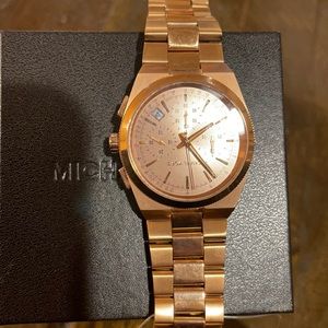 Brand new never used Michael Kors watch -rose gold color.